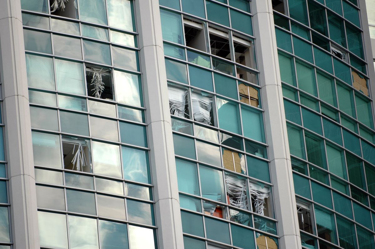 hurricane-damaged windows in high rise building
