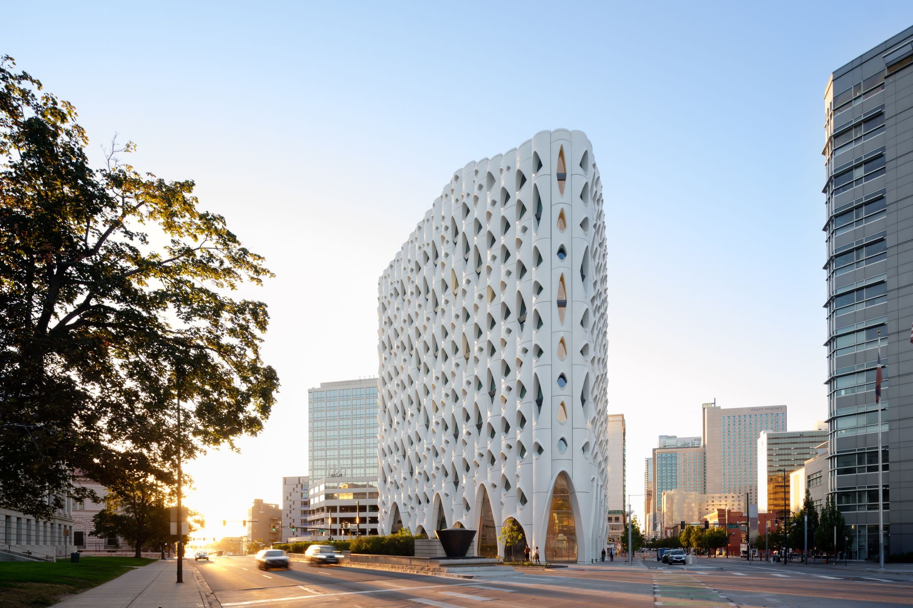 hotel tower with white facade and glass openings