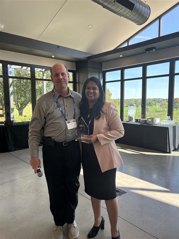 John Kent receives C.G. Carney Award from Urmilla Sowell