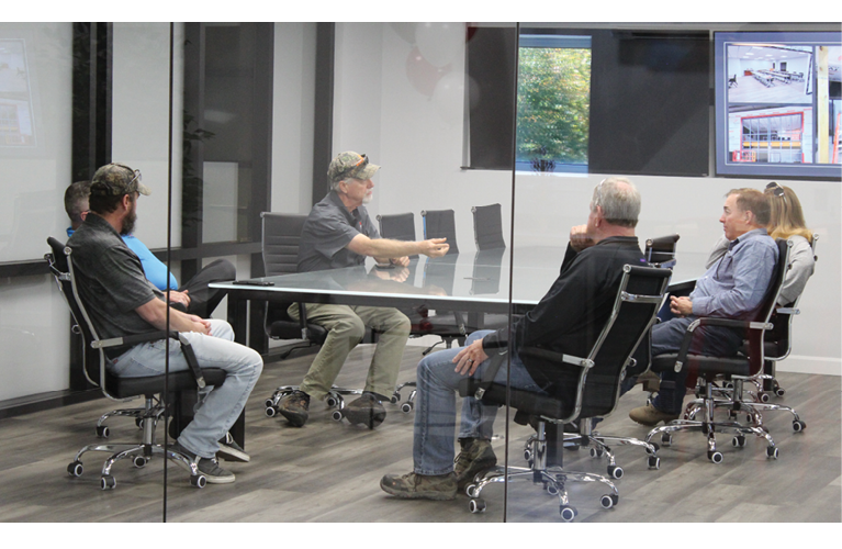 employees gather at a table