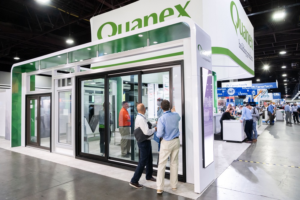 Attendees visit the Quanex booth during GlassBuild America 2021 in Atlanta.